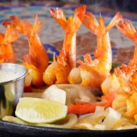 Camarones A La Plancha · Six jumbo shrimp sautéed grilled shrimp stuffed with jalapeño and topped with monterey jack ...