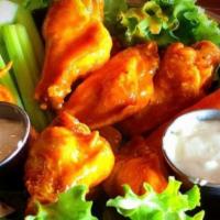 Saucer Wings (10) · Ten wings served with carrots and celery and  buffalo sauce