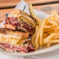 Reuben-Esque · Hot pastrami, jalapeno sauerkraut, melted Swiss cheese, and Russian dressing on toasted marb...