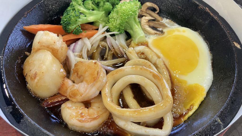 Day By The Seaside · Fesh squid &j jumbo shrimps and scallops served with Japanese terriyaki sauce.
