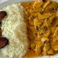 Mushroom Chicken Breast · Our grilled chicken breast in a creamy mushroom sauce. Comes with a side of white rice and s...