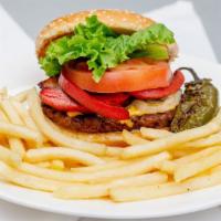 Juarez Style Burger With Fries · GRILLED SIRLOIN Burger with ham, winnie, white cheese, yellow cheese, grilled onions, grille...