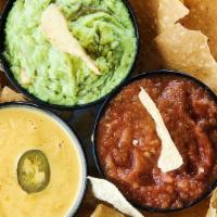 Trifecta · Crispy tortilla chips served with our homemade queso, salsa & guacamole