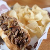 The French Dip · Beef or Chicken, Grilled Onions, Swiss, Mushrooms, Au Jus Dipping Sauce on Side.