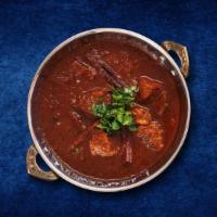 Lamb Rogan Josh · Classic brown curry cooked to perfection with tomatoes, yogurt, saffron, whole spices and su...