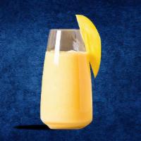 Mango Lassi · A thick smoothie made with fresh yogurt and flavored with premium mango pulp