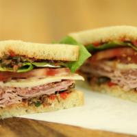 The Italian · Shaved salami and ham topped with a roasted red pepper black olive tapenade and provolone ch...