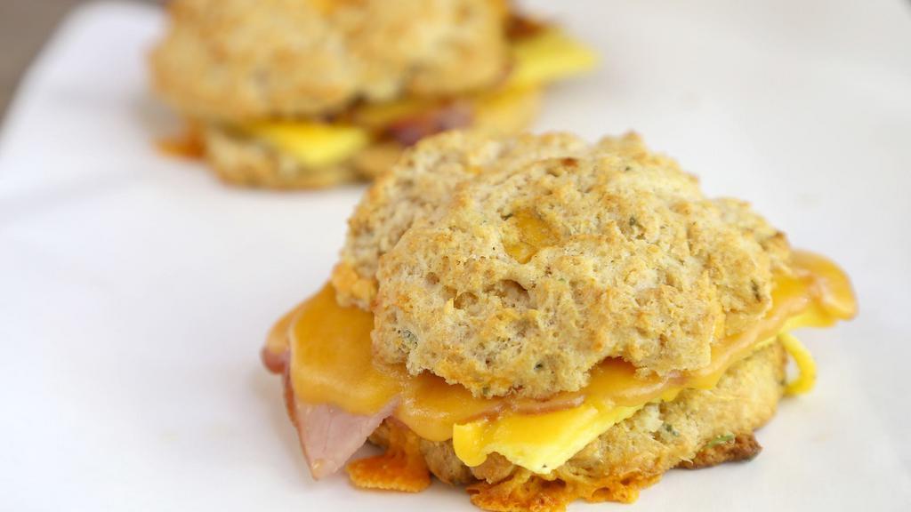 Breakfast Biscuit · Scrambled egg, ham or bacon and your choice of cheese on a cheddar garlic biscuit