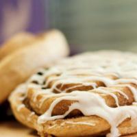 Frosted Raspberry Blueberry Cinnamon Roll · 