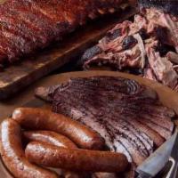 Family Meal · One lb sliced brisket, one lb chicken, 1/2 lb hot links with two sides.