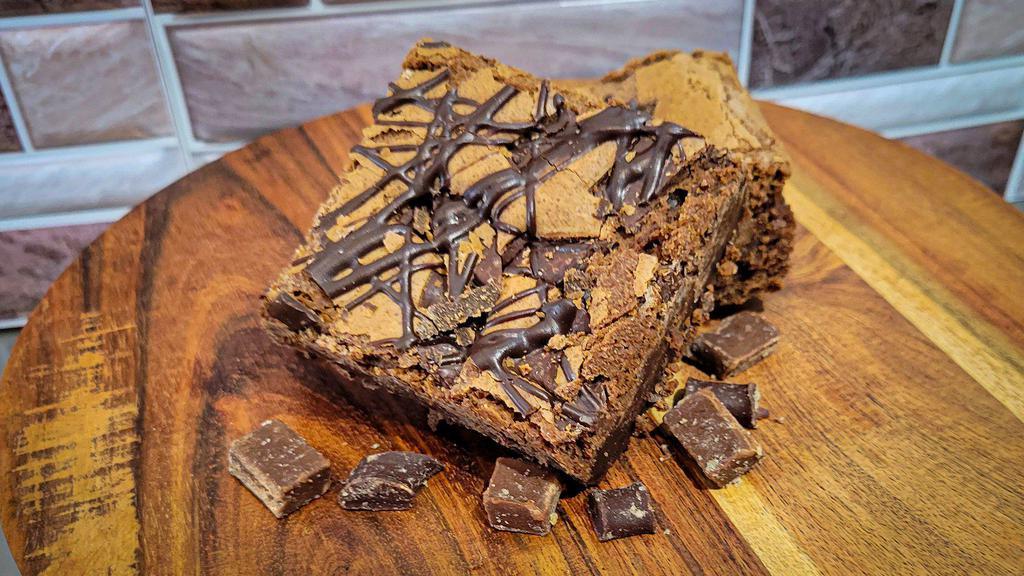 Large Deluxe Double Fudge Brownie · A large brownie with decadent chocolate chunks and an irresistible fudge drizzle added to the rich chocolate batter