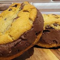 Chocolate Ice Cream Cookie Sandwich · Two of our chocolate chip cookies and a slab of chocolate ice cream in between.