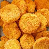 Fried Green Tomatoes · Green tomatoes lightly fried with breading.