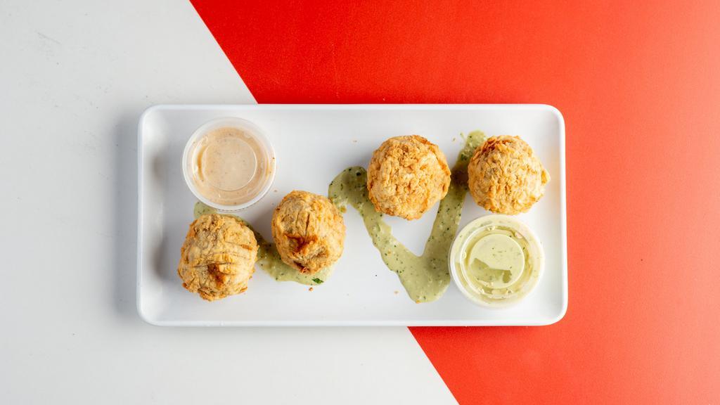 Boudin Balls · A classic Cajun staple. Four pieces breaded, fried , and served with multiple side sauces. Trust us!