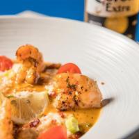 Shrimp And Grits  · Savory Grilled Shrimp resting in creamy grits topped with a smoked cream, chipotle, bacon, t...