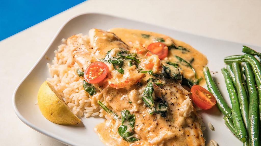 Redfish Pontchartrain · Seared Red Fish fillet topped with our Louisiana Pontchartrain sauce with mushrooms, crawfish tails, shrimp, and crab. Served with Green Beans and rice.