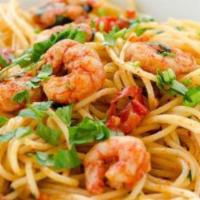 Linguine Con Gamberetti · Linguini pasta with sautéed shrimps, mushroom, green onions, crushed pepper, garlic, and oli...
