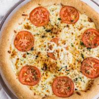 Margherita Pizza · Pizza dough spread with olive oil garlic, a slice of fresh tomato, fresh basil, and mozzarel...