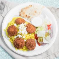 Falafel Plates · Rice, falafel, hummus, lettuce, tomato, cucumber, red onion, pickle, feta cheese, white and ...