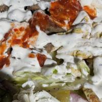 Combo Over Salad · Lamb and chicken, lettuce, tomato, cucumber, red onion, pickles, feta cheese, dressing, whit...