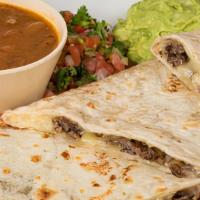 Quesadilla Grande · Large flour tortilla white melted cheese with your choice of meat: beef steak chicken or tro...