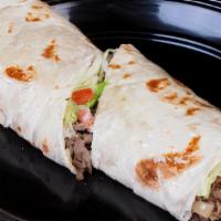 Burrito Regio · Giant flour tortilla beef steak avocado grilled onions white melted cheese refried beans let...