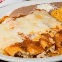 Enchiladas Chicken Rancheras · 5 chicken enchiladas ranchera salsa white melted cheese rice refied beans