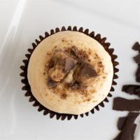 Brownie Peanut Butter Cup · Brownie topped with peanut butter cream cheese frosting, garnished with crumbled peanut butt...
