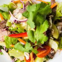Grilled Steak Salad (Yum Nuea) · Grilled flat iron steak with spicy tangy mixed greens. Gluten-free, Signature Dish.