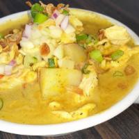 Yellow Curry (Kang Kari) · with potato, sweet-sour cucumber. Gluten-free. Vegetarian option.