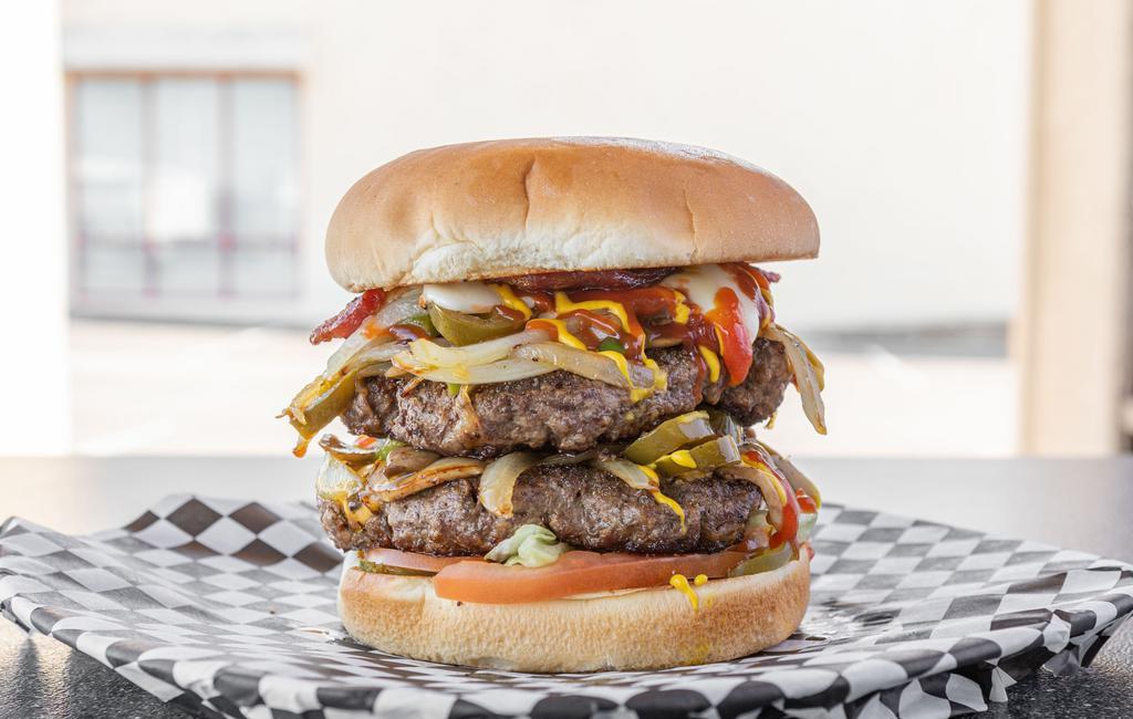 The Double Mega Extreme Cheeseburger · Sauteed onions, mushrooms, jalapenos, bell peppers, American and provolone cheese, mayo, ketchup, hickory sauce, mustard, lettuce, tomato, pickles, bacon. Double meat (1 lb)