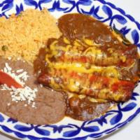 Enchiladas San Antonio · two cheese enchiladas topped with our chili meat gravy & aged cheddar cheese, served with fr...