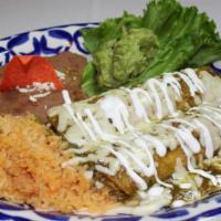 Enchiladas Verdes · Two shredded chicken enchiladas topped with tomatillo salsa, Monterey jack cheese & a light ...