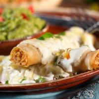 Enchiladas Sour Cream · two chicken enchiladas smothered in sour cream sauce & Monterey jack cheese, served with fri...
