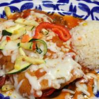 Enchiladas Primaveras · wo enchiladas filled with sauteed vegetables & topped with salsa ranchera & Monterey jack ch...