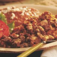 Chorizo Mexicano · two eggs scrambled with our house-made Mexican chorizo, served with breakfast potatoes & fri...