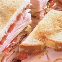 Sandwiches - Turkey Club · turkey, bacon, cheddar and mustard, built on three slices of white or wheat toast