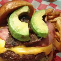Bombones Burger · Our signature burger with ham, fajita beef, and sliced avocado! Served with American cheese,...
