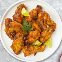 Pepper Stopper Wings · (Halal) Fresh chicken wings fried until golden brown, and tossed in lemon pepper sauce.