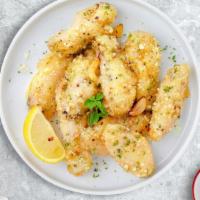 Garlic Parm Party Wings · (Halal) Fresh chicken wings fried until golden brown, and tossed in garlic parmesan sauce.