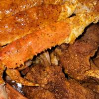 Surf & Turf · 6 wings spicy garlic
10 shrimp
1 snow crab cluster
1 corn 1 potato