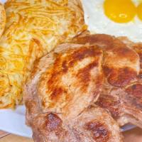 Pork Chops & Eggs · Grilled center cut pork chops, two large country eggs, golden hash browns or grits, toast or...