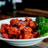 Sesame Chicken · Deep-fried chicken with sweet and sour   garnished with sesame seeds.