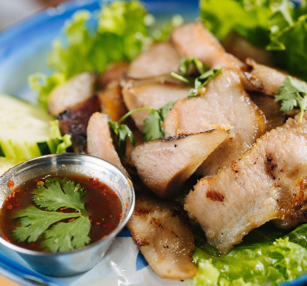 G9-Kor Moo Yaang · Our special grilled marinated pork, served with sticky rice.