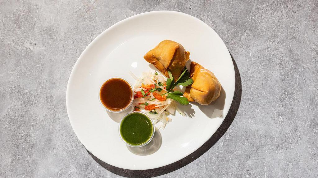 Samosa · By O'Desi Aroma. 2 pieces. Pastry triangles with savoury potatoes and peas. Includes side of spicy and tamarind sauce. Vegan. Gluten-Free. Contains tree nuts, peanuts, and nightshades. We cannot make substitutions.