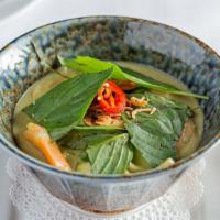 Cari Tom - Green Shrimp Curry · Gluten-free. Gulf shrimp, bamboo shoots, lime leaf, snap peas, zucchini, spicy coconut, gree...