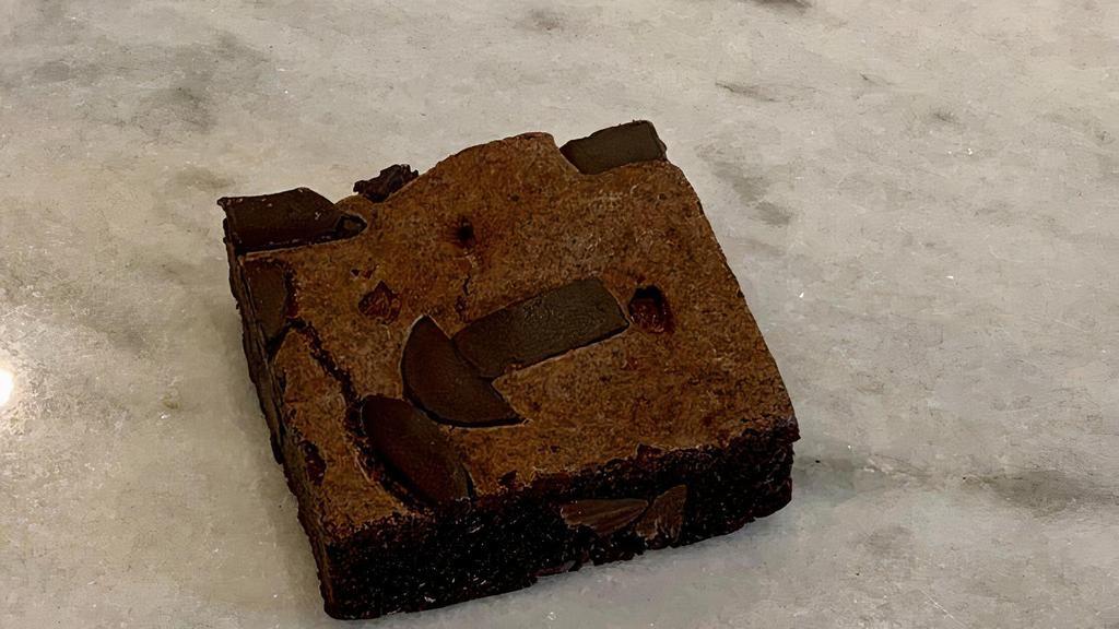 Gluten Free Brownie · Irresistible brownies made with pure, dark Honduran chocolate. Baked with cage-free eggs, gluten-free flour, and sustainably sourced chocolates. Free of GMO’s and artificial additives.
