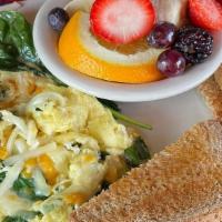 Green Eggs Breakfast · Two scrambled eggs with spinach and cheese, fresh fruit, and wheat toast.