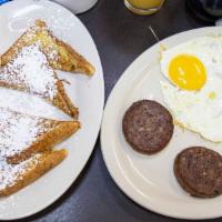 French Toast Combo · With four triangles, two eggs, and choice of bacon or sausage.