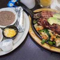 Ultimate Fajitas · Served with chips and salsa, rice and beans. Grilled beef and chicken fajita, grilled sausag...
